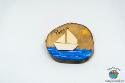 Boat with driftwood and canvas sail